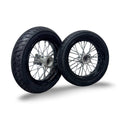 Two motorcycle wheels with black tires on a white background