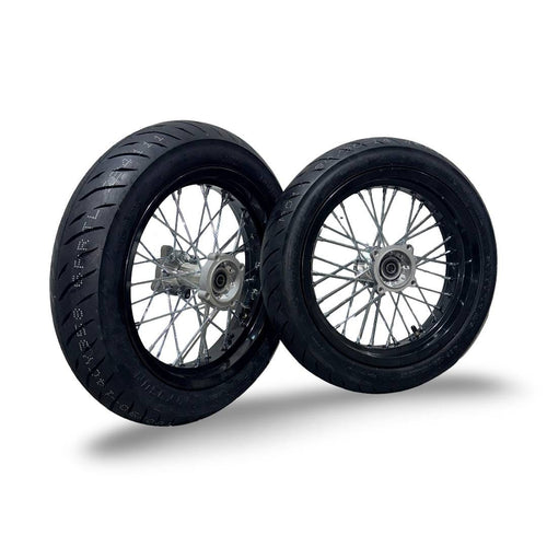 Two motorcycle wheels with black tires on a white background